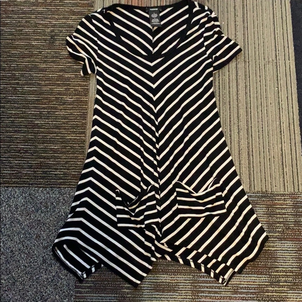long black and white striped shirt with pockets.